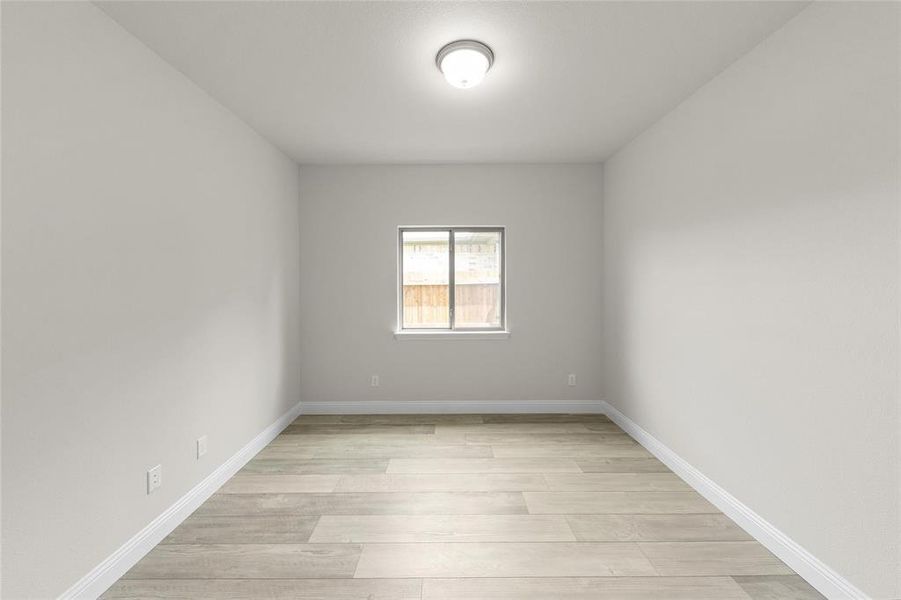 Empty room featuring light hardwood / wood-style flooring