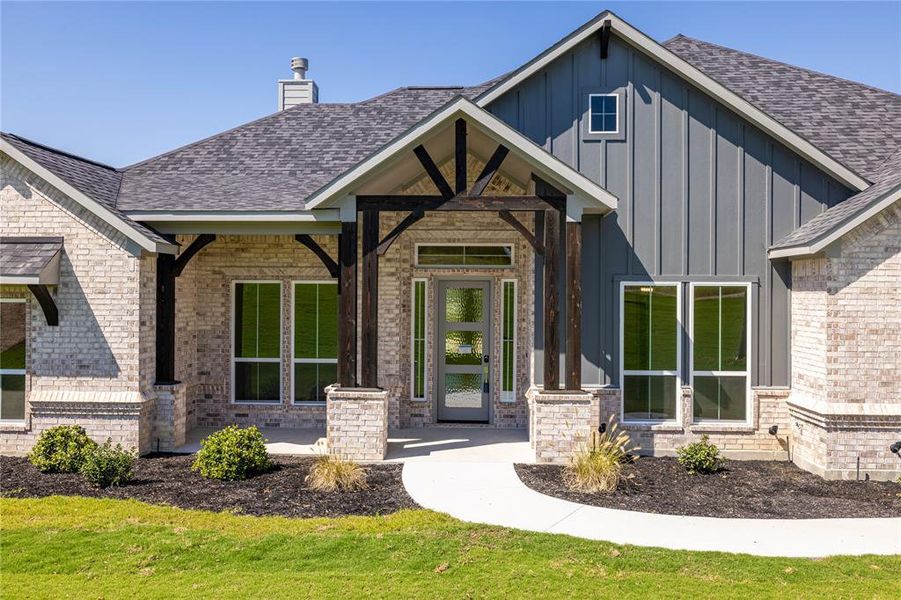 View of front of property with a front yard