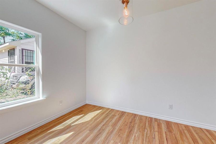 Un-staged - Dining room with light hardwood / wood- style floors