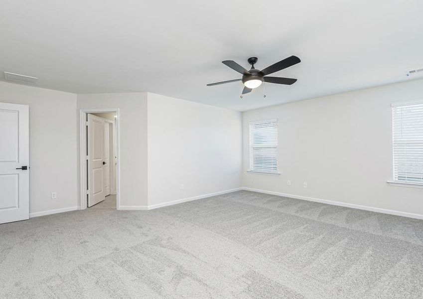 This spacious master bedroom offers plenty of bright, natural light