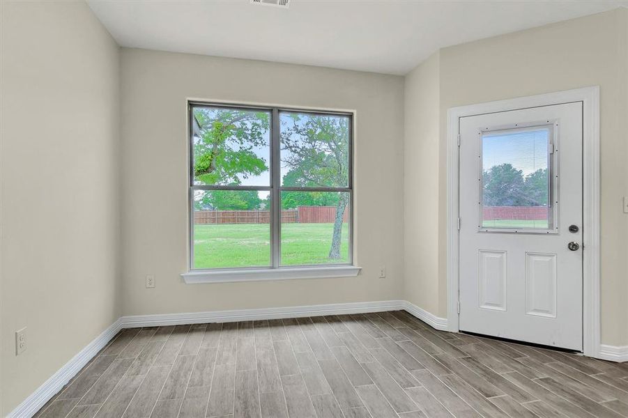 Entryway featuring light Tile Plank flooring