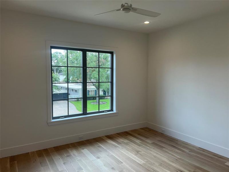 Large secondary bedrooms with ceiling fans and recessed lighting.