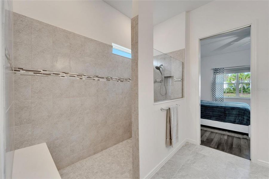 Large walk-in shower with bench