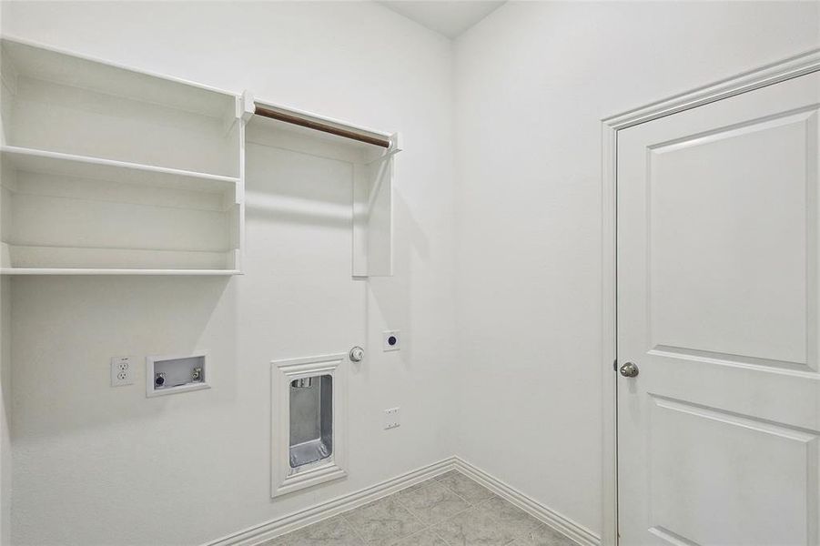 Laundry room featuring hookup for a gas dryer, washer hookup, and electric dryer hookup