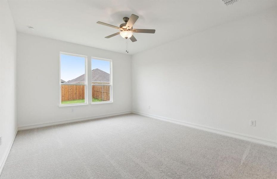 Elegant owner's bath with large windows *real home pictured