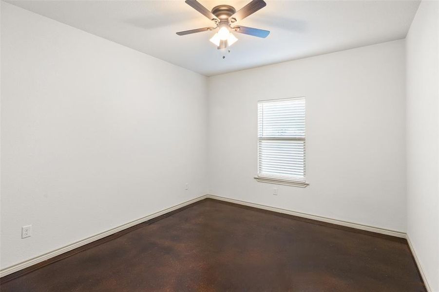 Unfurnished room featuring ceiling fan