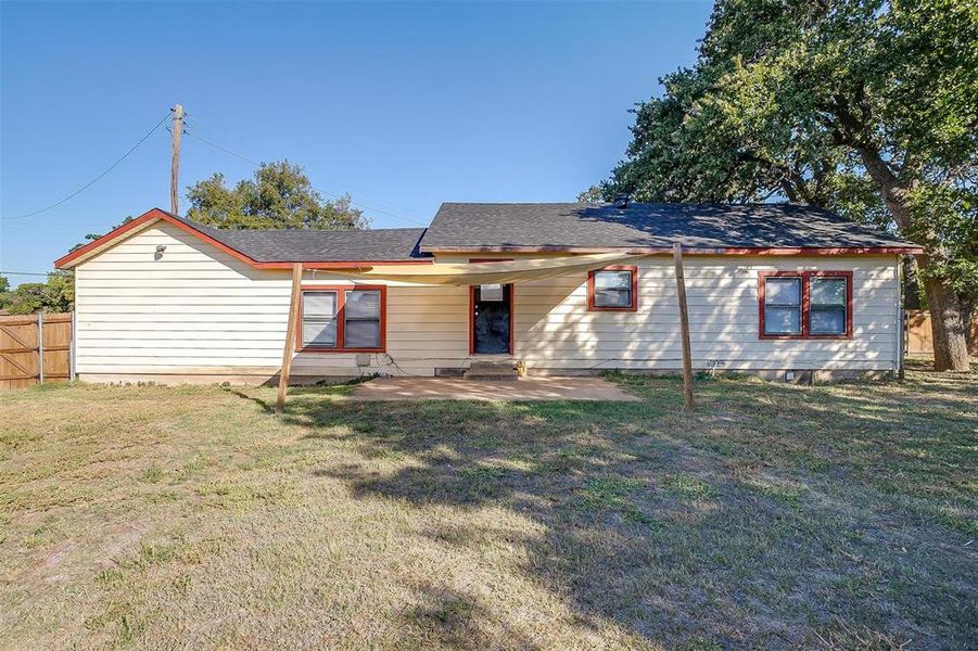 Single story home featuring a front lawn