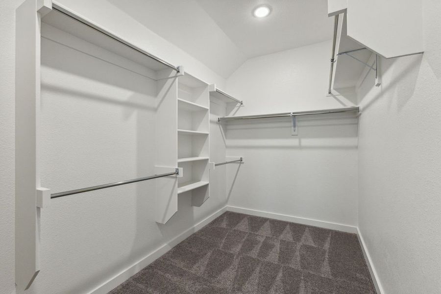 Primary Closet in the Oscar home plan by Trophy Signature Homes – REPRESENTATIVE PHOTO