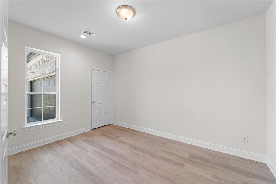 Empty room with light wood-type flooring