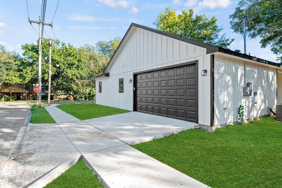 Garage featuring a yard