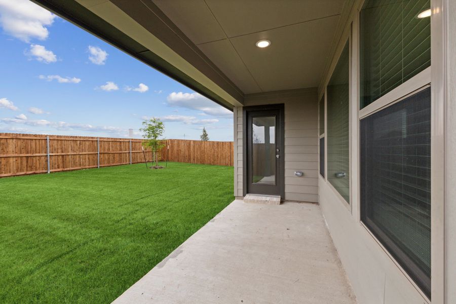 Covered Patio in the Oscar home plan by Trophy Signature Homes – REPRESENTATIVE PHOTO