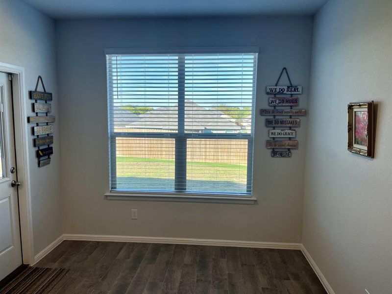 Breakfast room featuring dark wood-type flooring