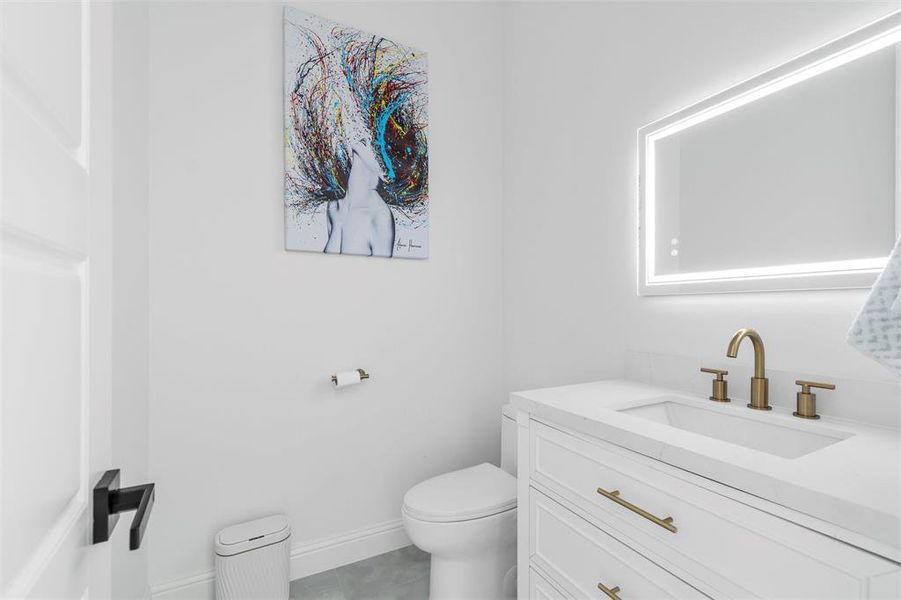 Bathroom featuring vanity and toilet