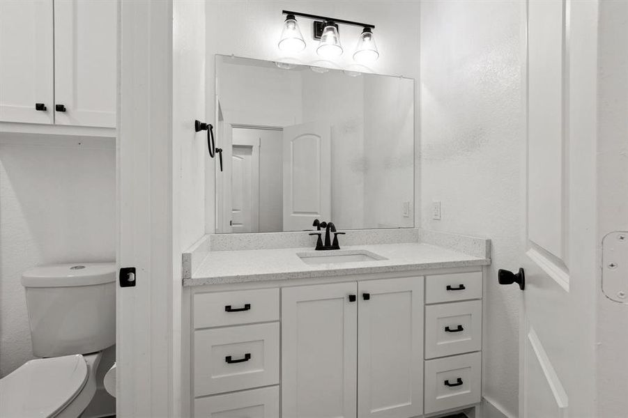 Bathroom with vanity and toilet