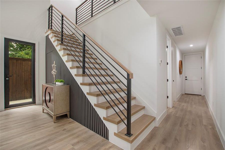 Stairs with hardwood / wood-style floors