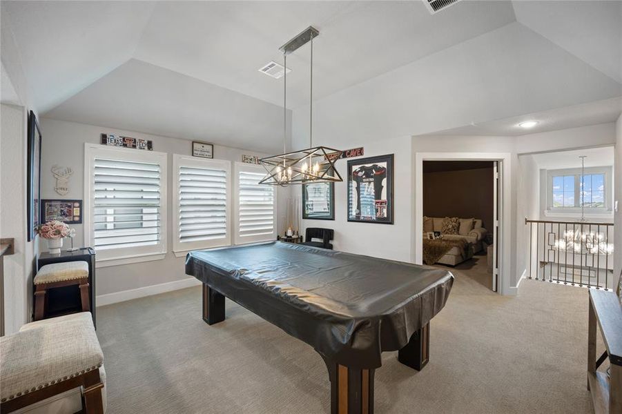 Recreation room with a healthy amount of sunlight, light colored carpet, and billiards