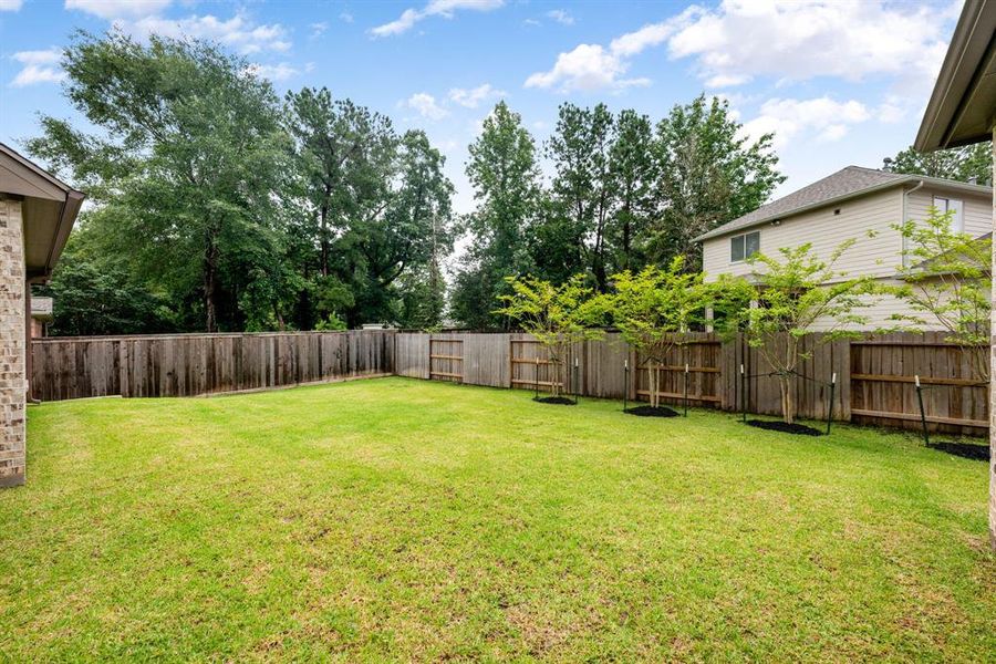 Embrace outdoor living in the expansive backyard, perfect for family gatherings, gardening, or simply unwinding in your private oasis.