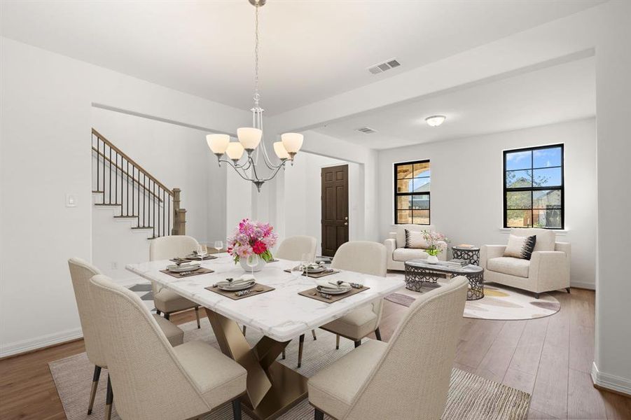 The dining and formal living area is a perfect blend of style and functionality, providing an inviting space for memorable meals and gatherings.