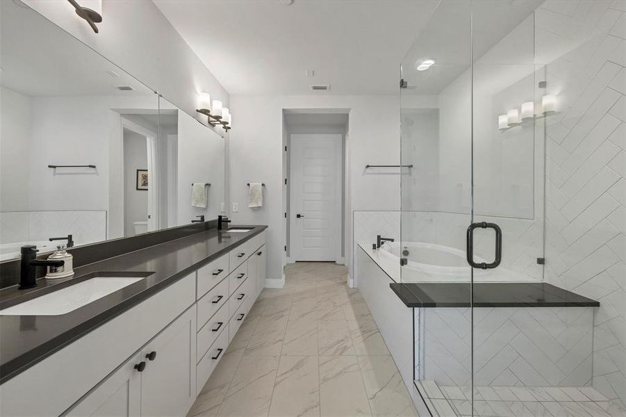 A luxurious freestanding tub and a spacious walk-in shower create a serene environment for relaxation and rejuvenation