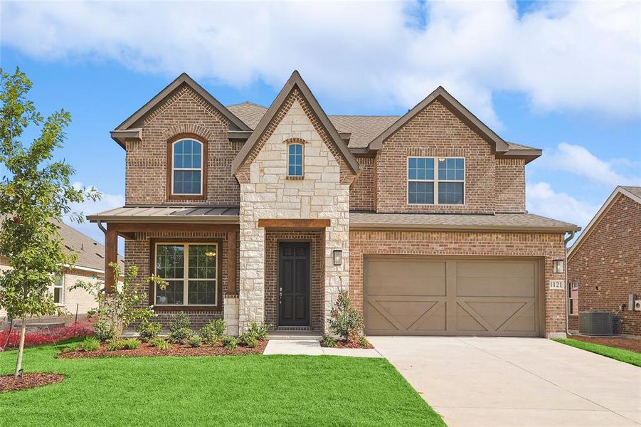 View of front of property featuring a garage, central air condition unit, and a front yard