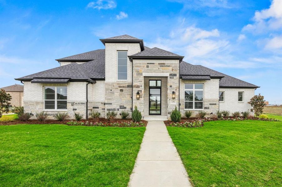 View of front of property with a front yard