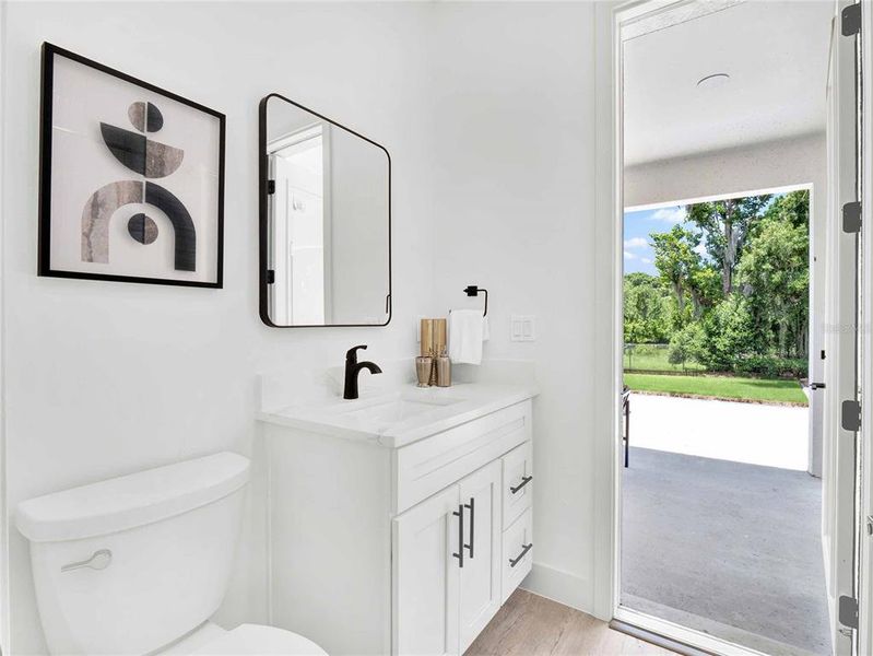 Bathroom for second suite with access to the back patio