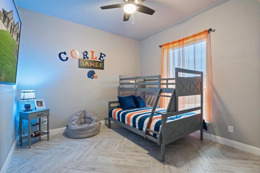 Bedroom featuring parquet flooring and ceiling fan