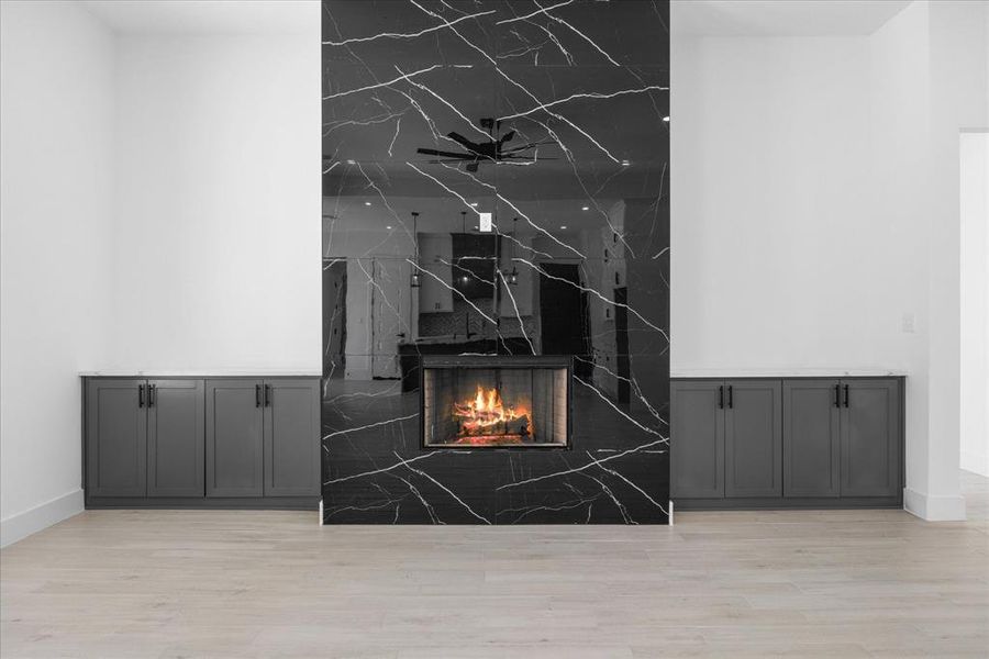 Marble from floor to ceiling and wood burning fireplace