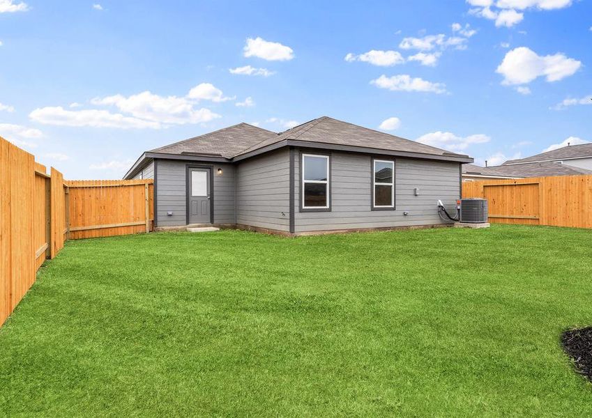 A spacious fenced in backyard.