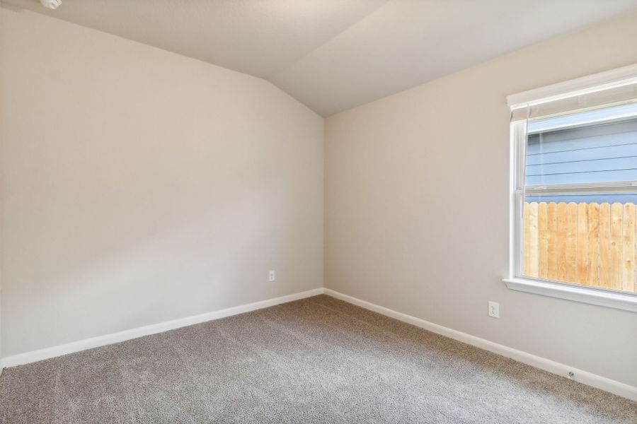 Guest bedroom in the Hughes floorplan at a Meritage Homes community.