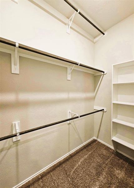 This master closet in endless- check out the 3 wardrobe racks!