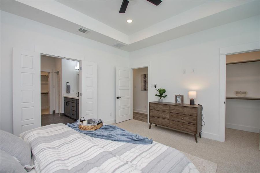 This primary bedroom features 2 closets. Model home photos - FINISHES AND LAYOUT MAY VARY! Ceiling fans are NOT INCLUDED!