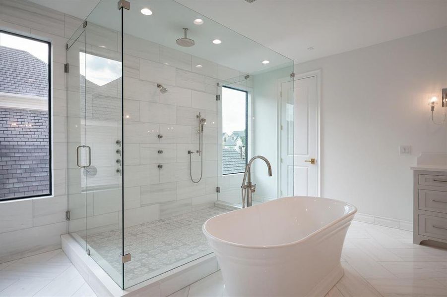 Bathroom featuring vanity, independent shower and bath, and tile patterned floors