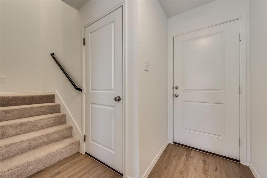 Doorway to outside featuring light hardwood / wood-style floors