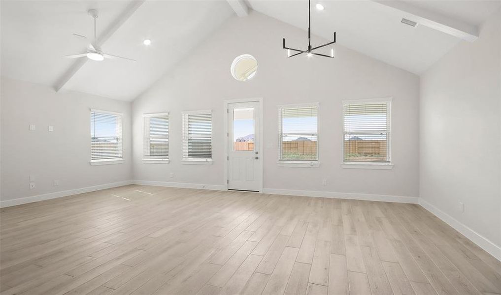 Great room and dining area with vaulted ceilings