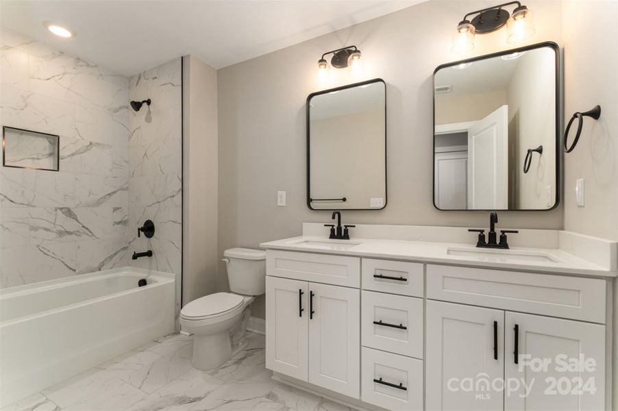 Magnificent upstairs bathroom with dual vanities and tiled shower (Representative Photo)