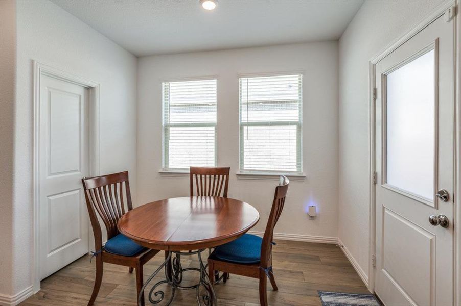 Dining space featuring wood-type flooring