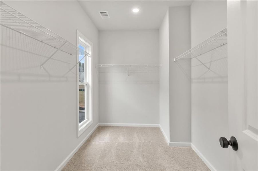 Natural light even pours into your large walk-in closet!Photos shown are for viewing purpose only, home is not yet finished