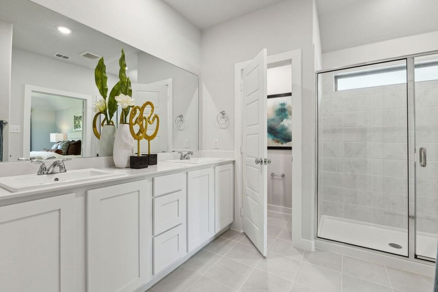 Primary Bathroom in the Emmy II home plan by Trophy Signature Homes - REPRESENTATIVE PHOTO