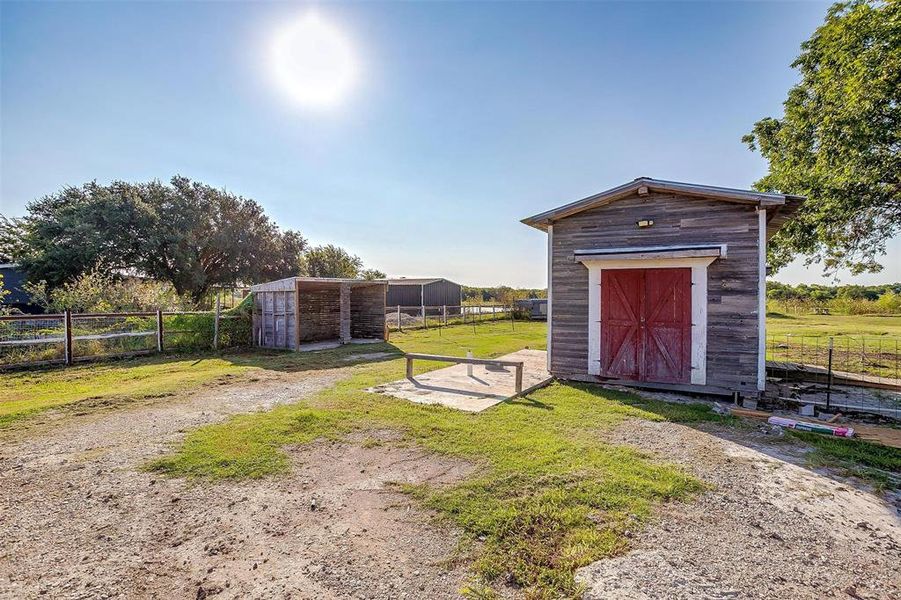 View of outbuilding featuring a rural view