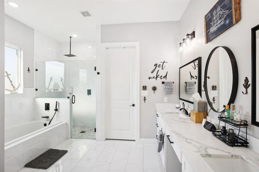 Primary Bath with separate shower dual sinks and vanity space