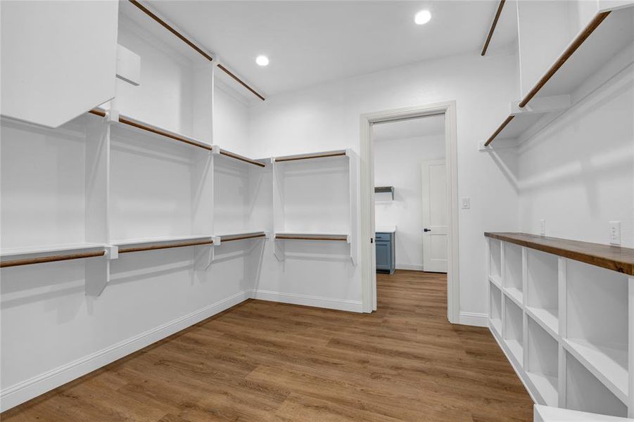 Walk in closet featuring hardwood / wood-style flooring