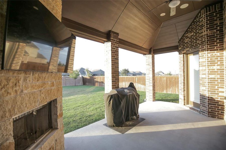 View of patio featuring a grill