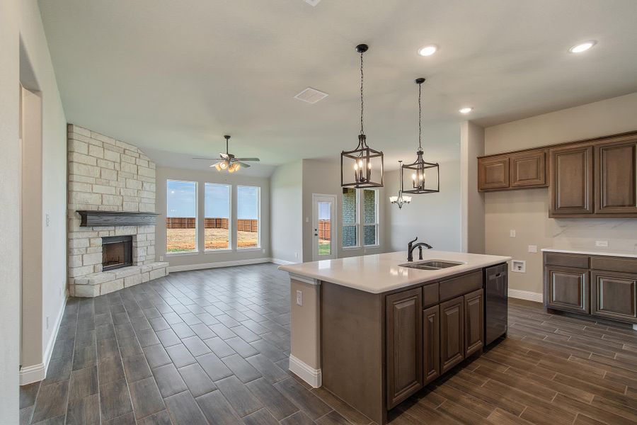 Kitchen & Family Room | Concept 2199 at Massey Meadows in Midlothian, TX by Landsea Homes