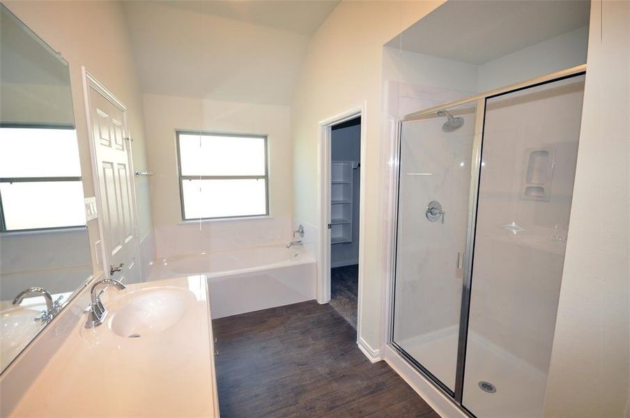 Master Bath offers a spacious double vanity, a soaking tub and a separate shower.