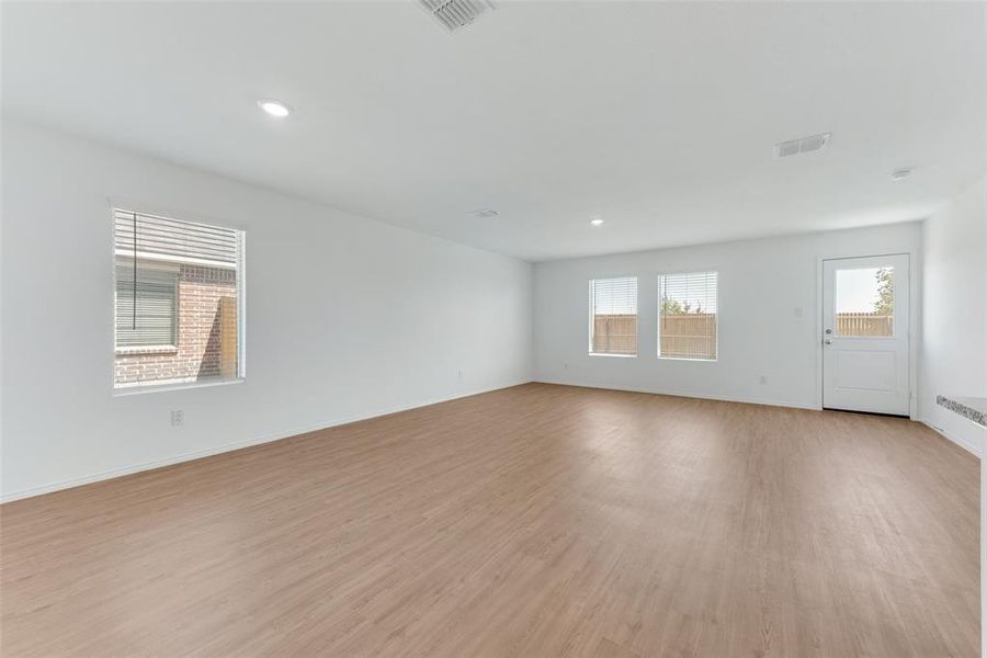 Spare room featuring light wood-type flooring