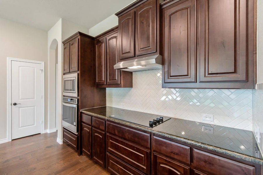 Kitchen | Concept 2671 at Oak Hills in Burleson, TX by Landsea Homes