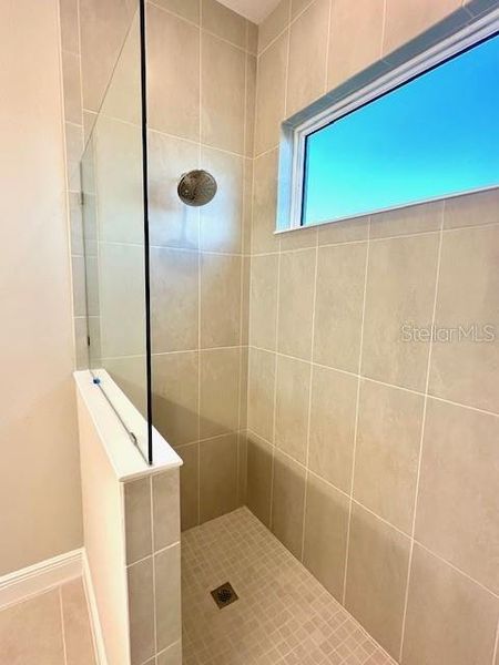 Walk-in shower in primary bath.