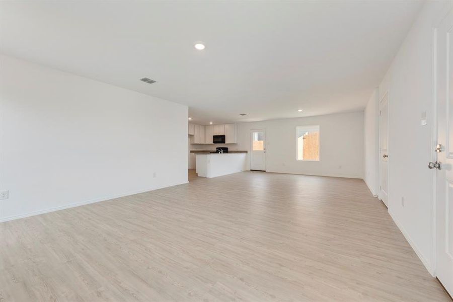 Unfurnished living room featuring light hardwood / wood-style floors