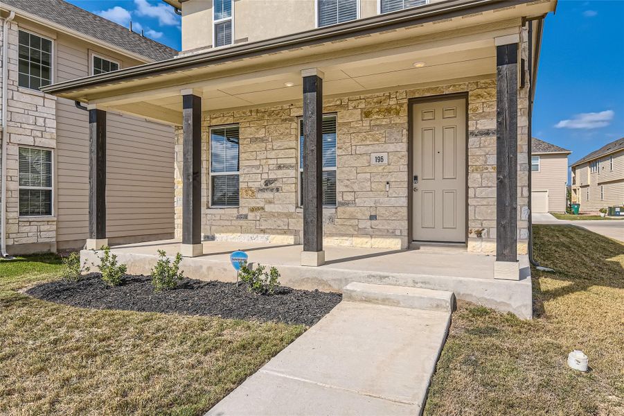 Striking curb appeal with stone & stucco masonry and a welcoming covered front porch lined with gorgeous wood pillars.